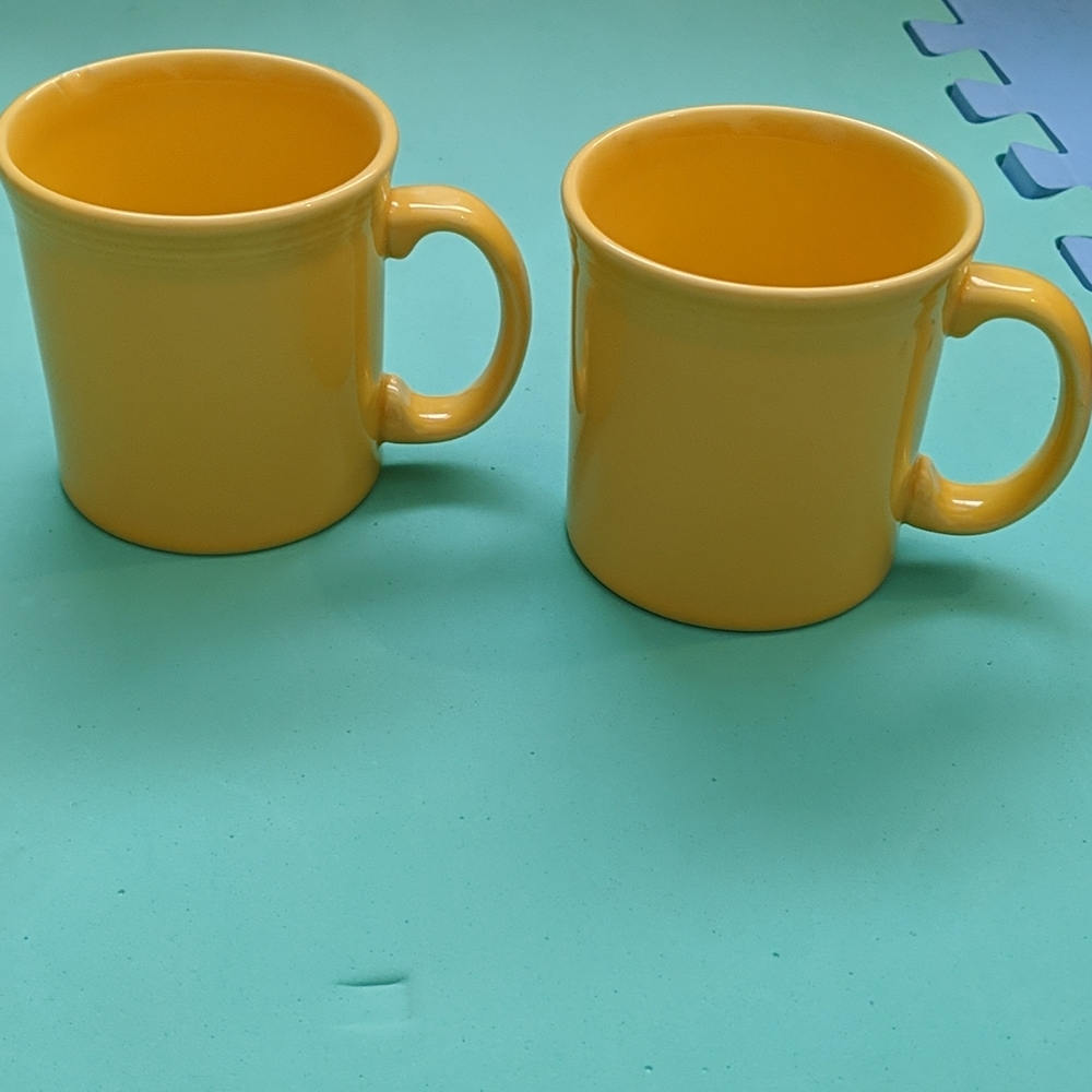 2 yellow Fiesta mugs